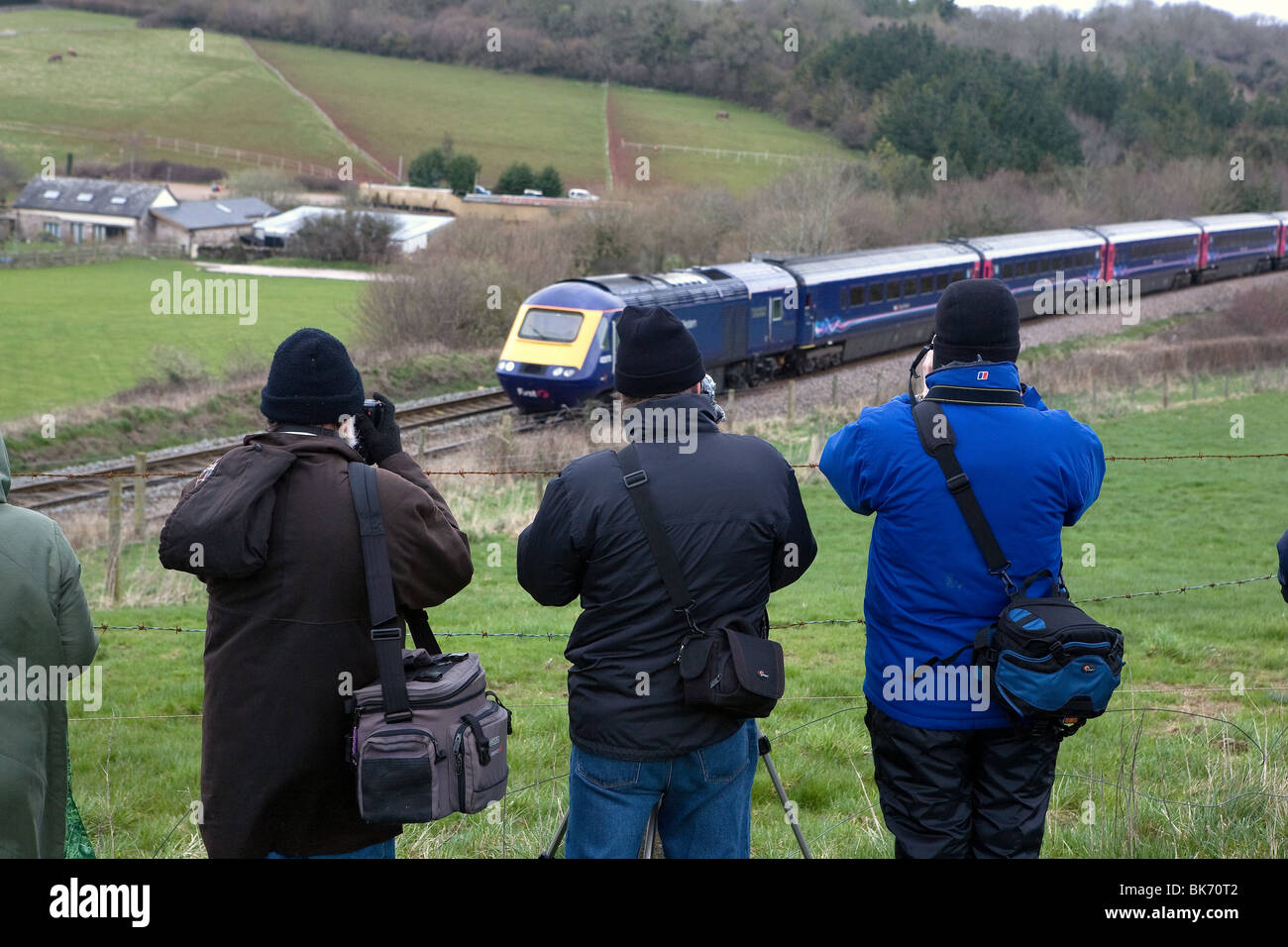 Trainspotters at dainton bank in Devon photographing trains. Stock Photo