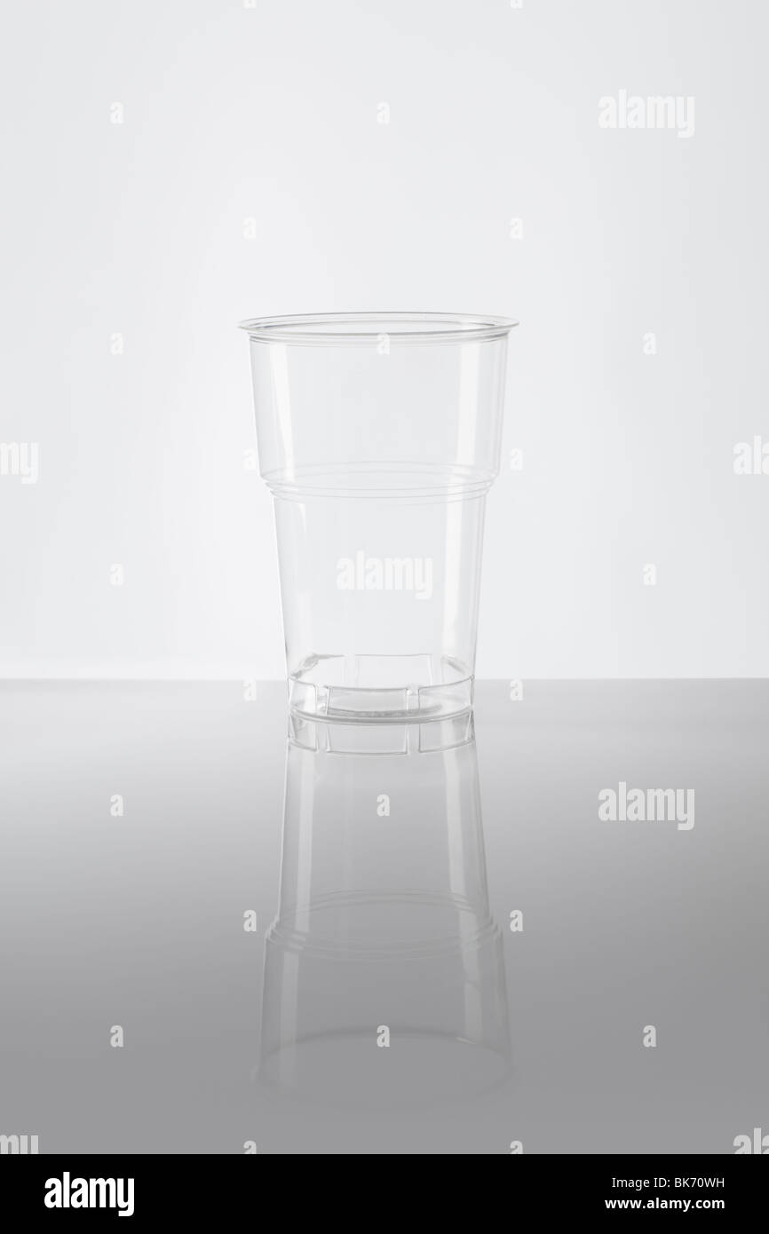 Empty disposable plastic cup made of clear plastic Stock Photo