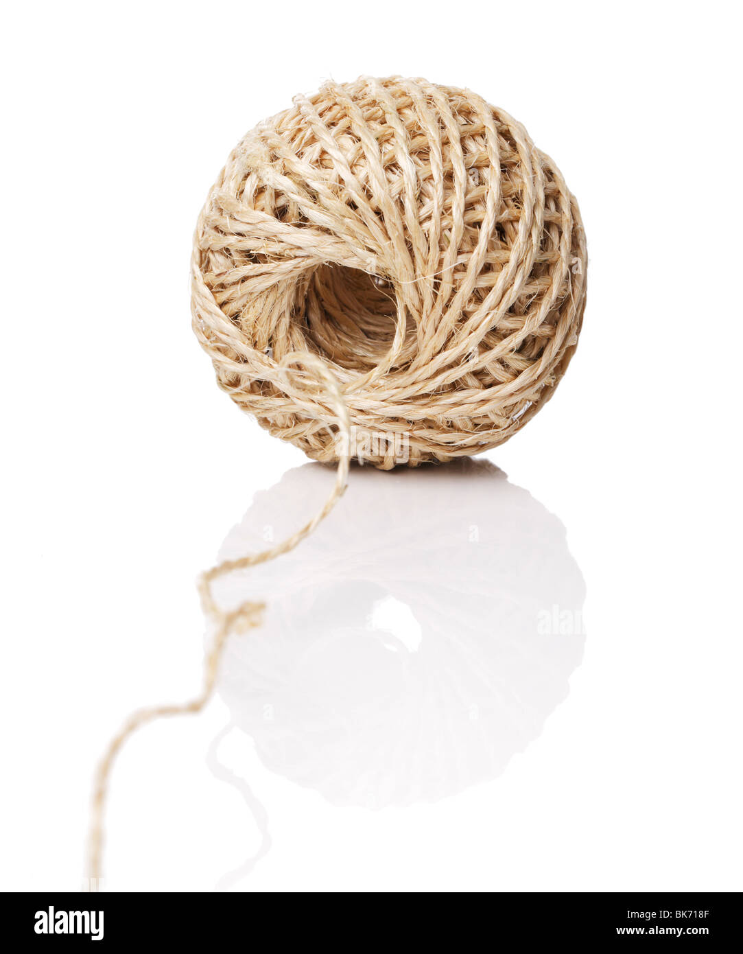 A Roll of natural fiber string on reflective background Stock Photo Alamy