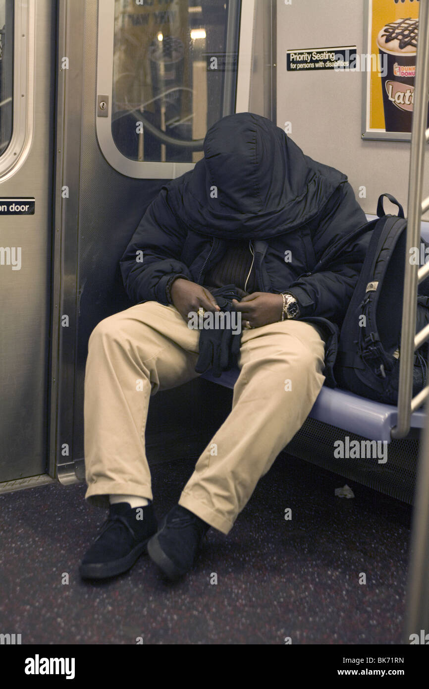 Homeless man sleeping on train hi-res stock photography and images - Alamy