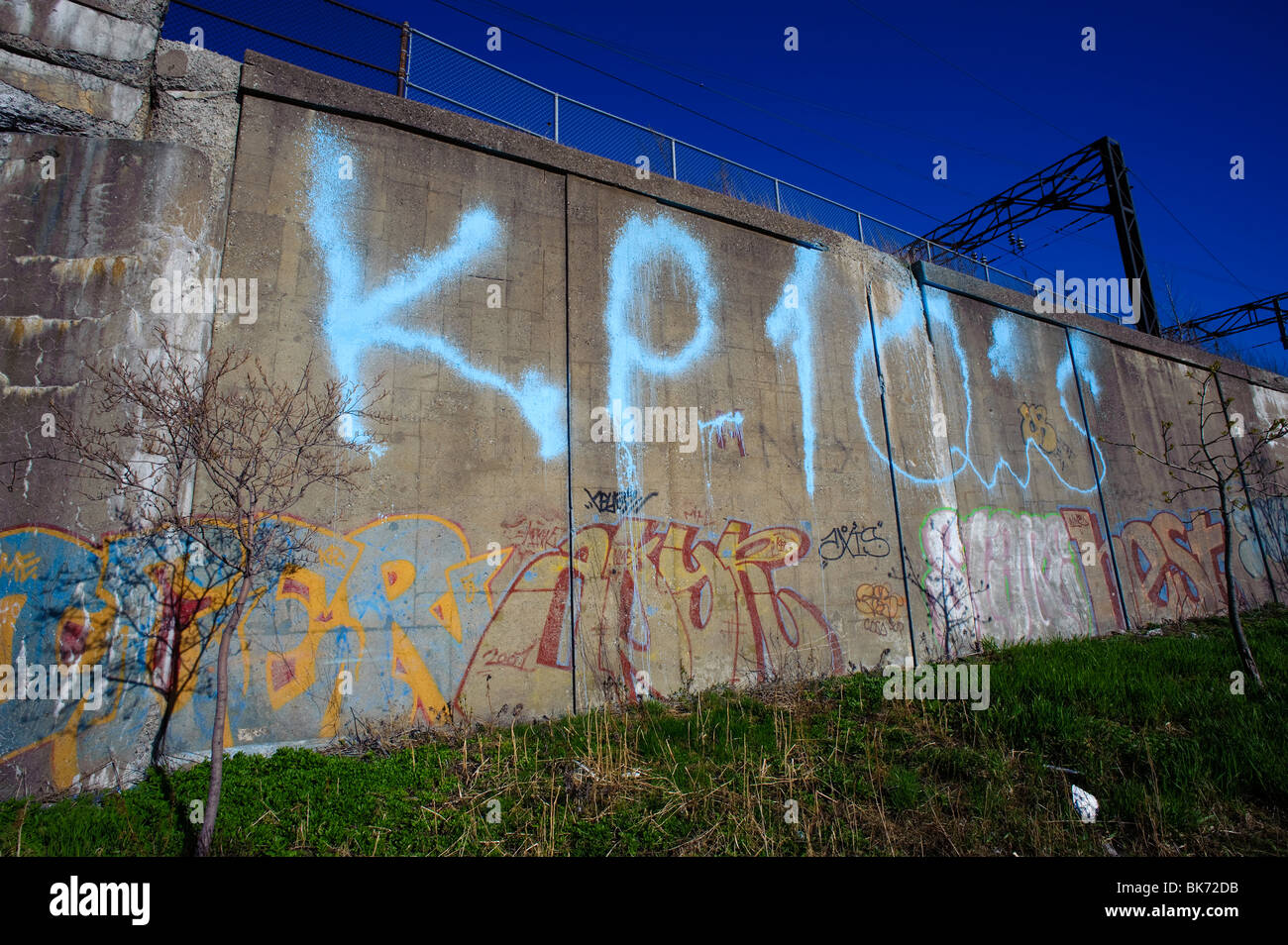 Concrete wall adorned with graffitis, near Lachine Canal, Montreal, Quebec, Canada. Stock Photo