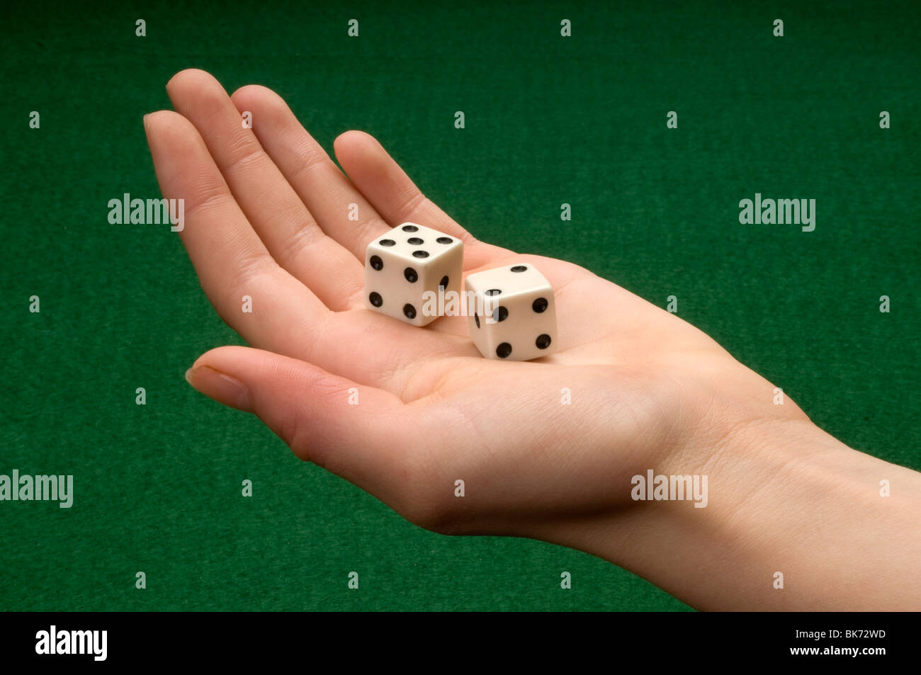 hand holding pair of dice Stock Photo
