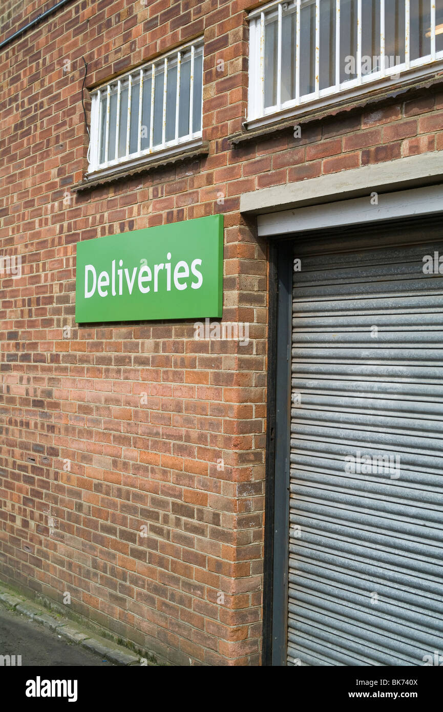 Deliveries Sign at Rear of Shop Stock Photo