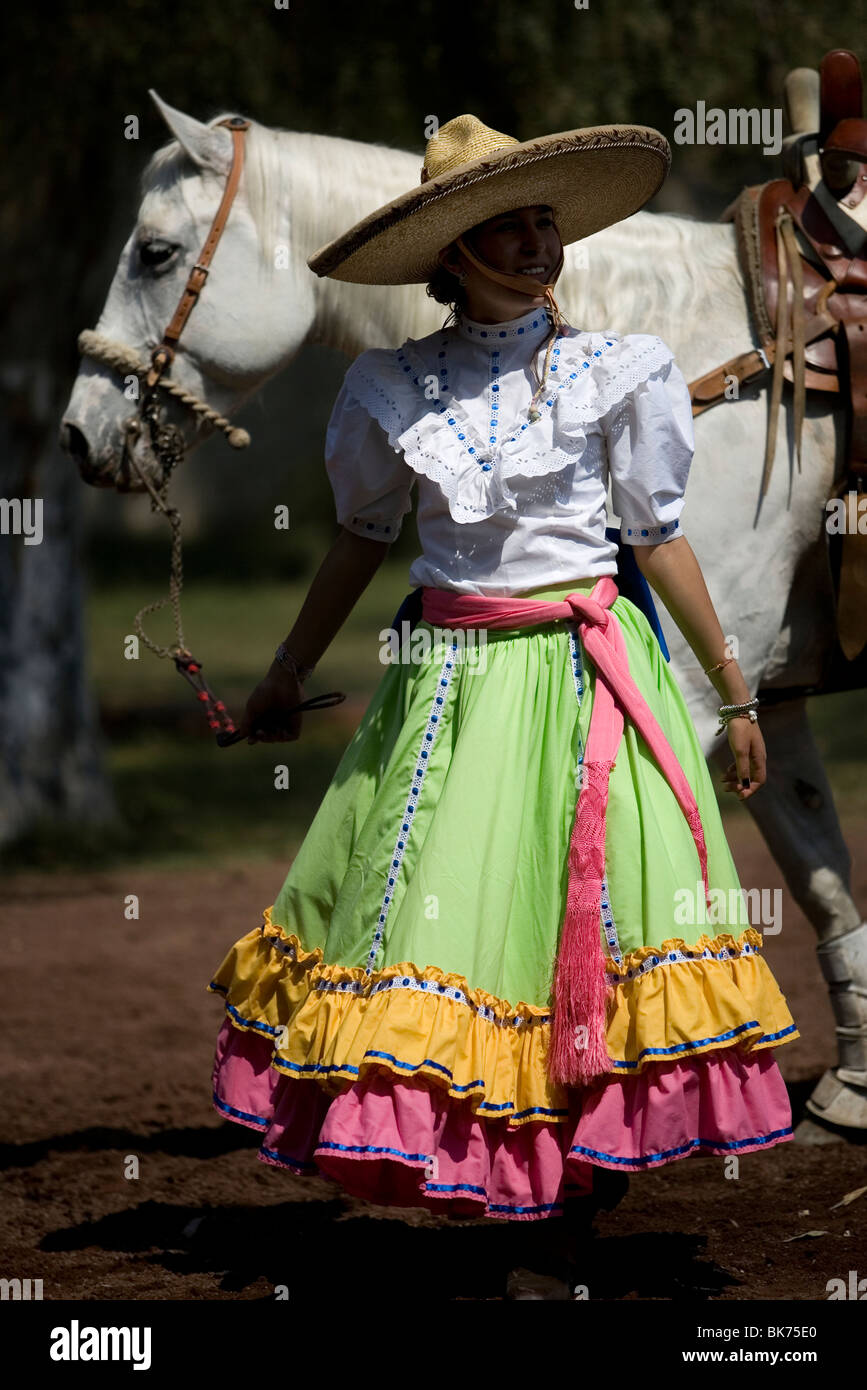 A member of the El Herradero team leads her horse after competing in an  Escaramuza in Mexico City Stock Photo - Alamy