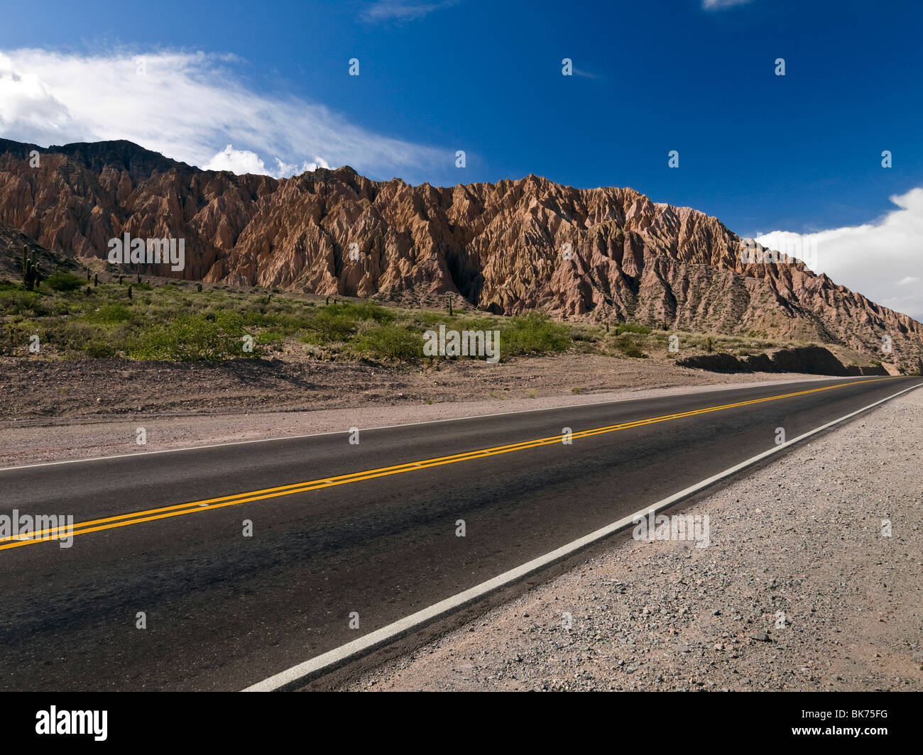 A straight road across the northwest desert in Argentina. Stock Photo