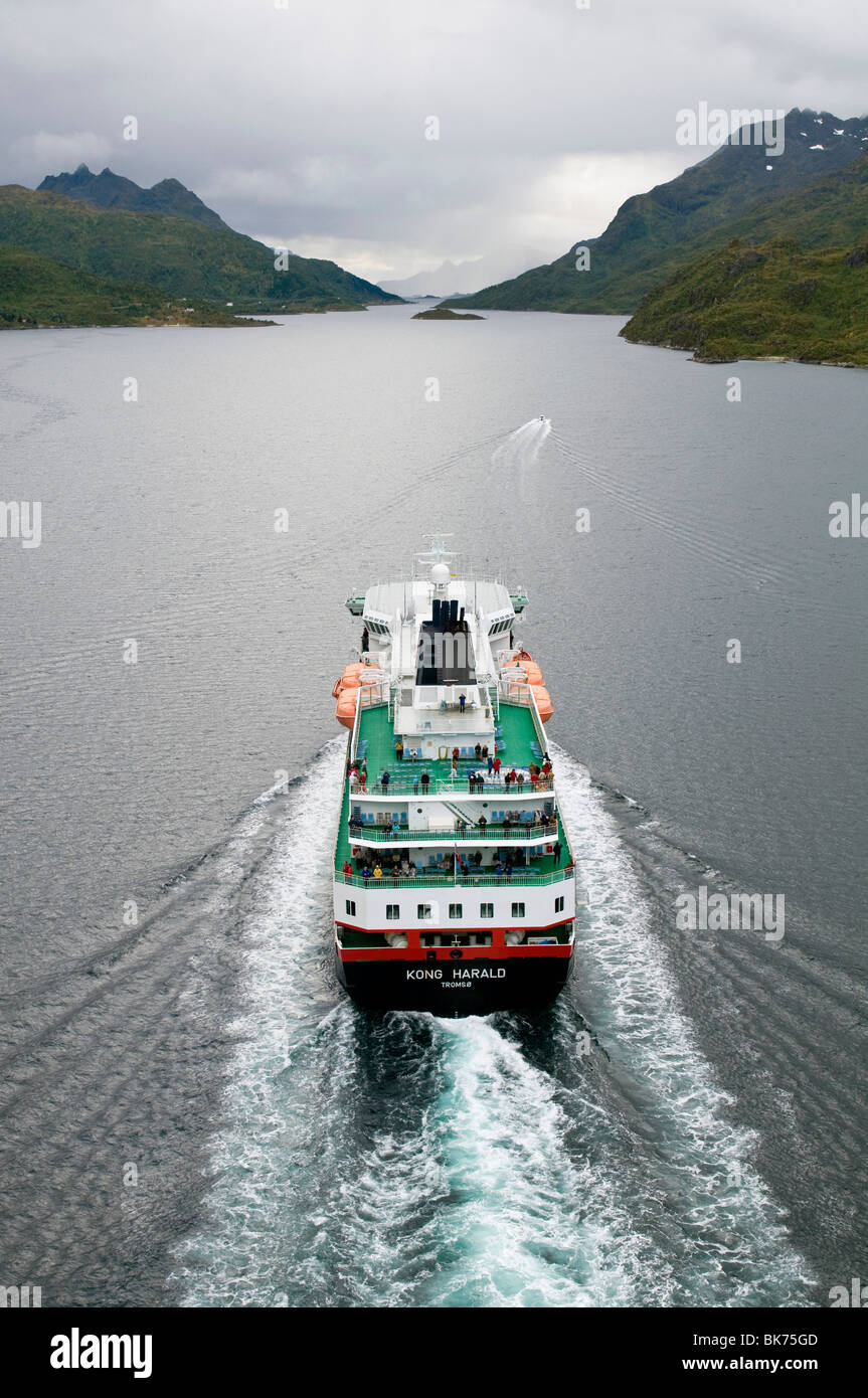 The coastal express liner Hurtigruten 'Kong Harald' seen from above in the fjord Raftsundet, North Norway. Stock Photo