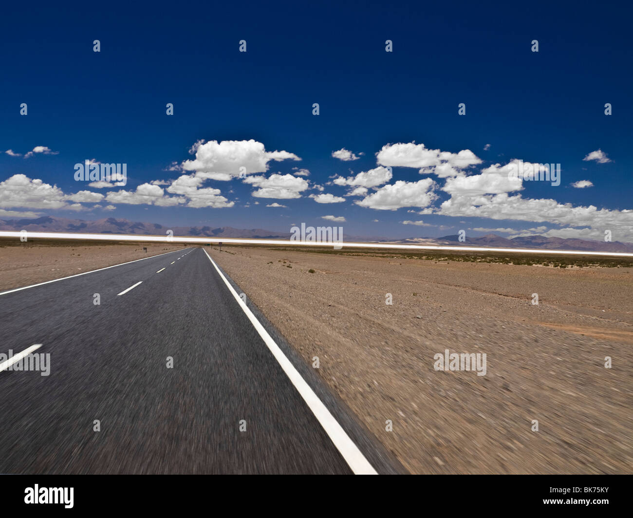A straight road to the salt mine. Blurred by the motion. Stock Photo
