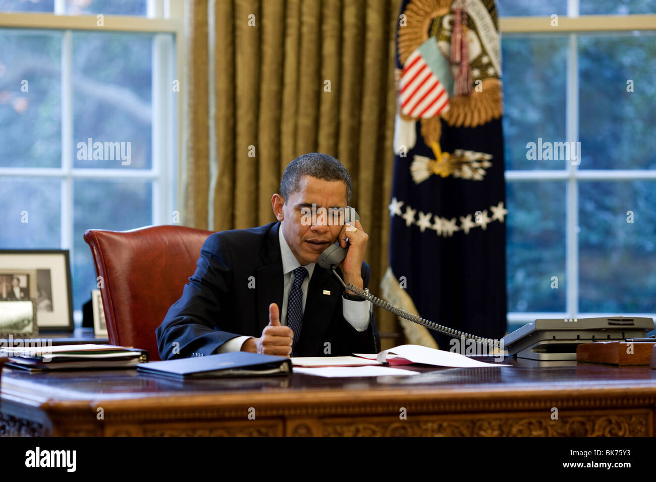 President Barack Obama talks with Russian President Dmitry Medvedev on the phone in the Oval Office. Stock Photo