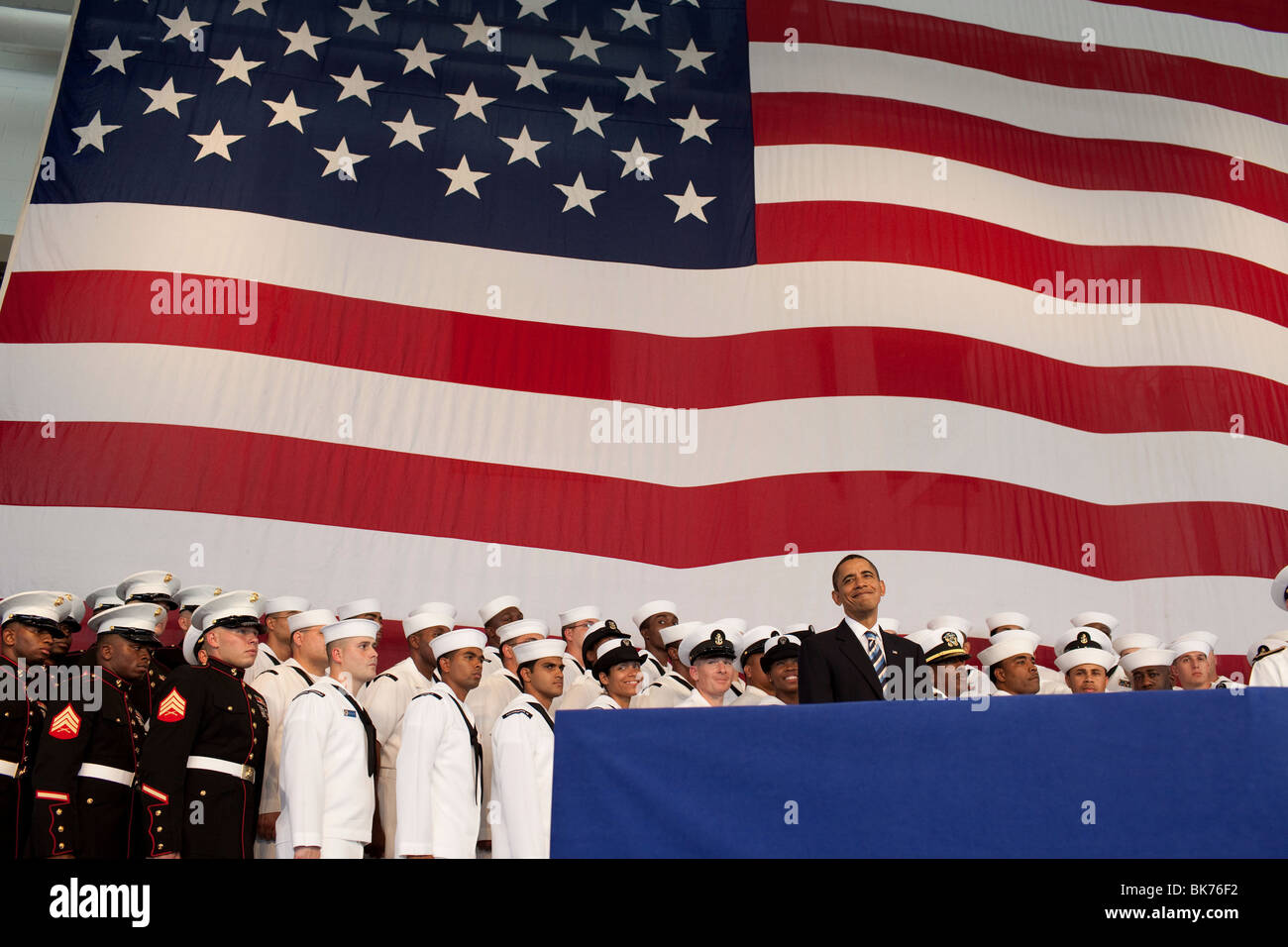 President Barack Obama stands on stage prior to delivering remarks to servicemen and women at Naval Air Station Jacksonville, FL Stock Photo