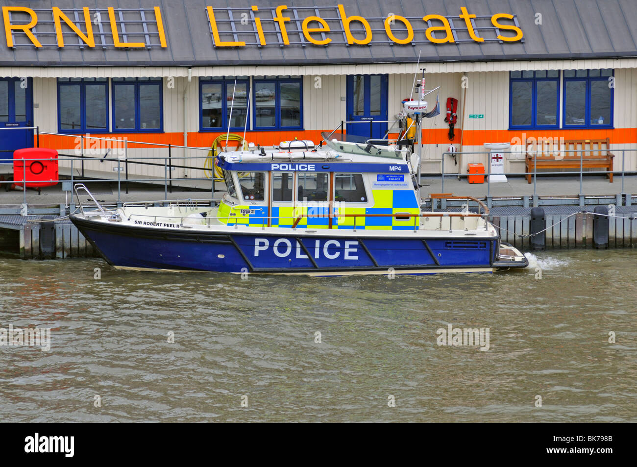 Moored Police boat moored on the Thames embankment, London, United Kingdom Stock Photo