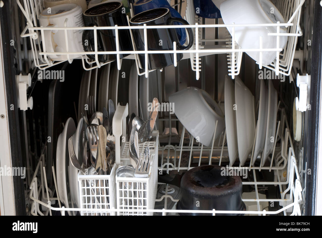 Dishes, mugs and cutlery in a dishwasher Stock Photo Alamy
