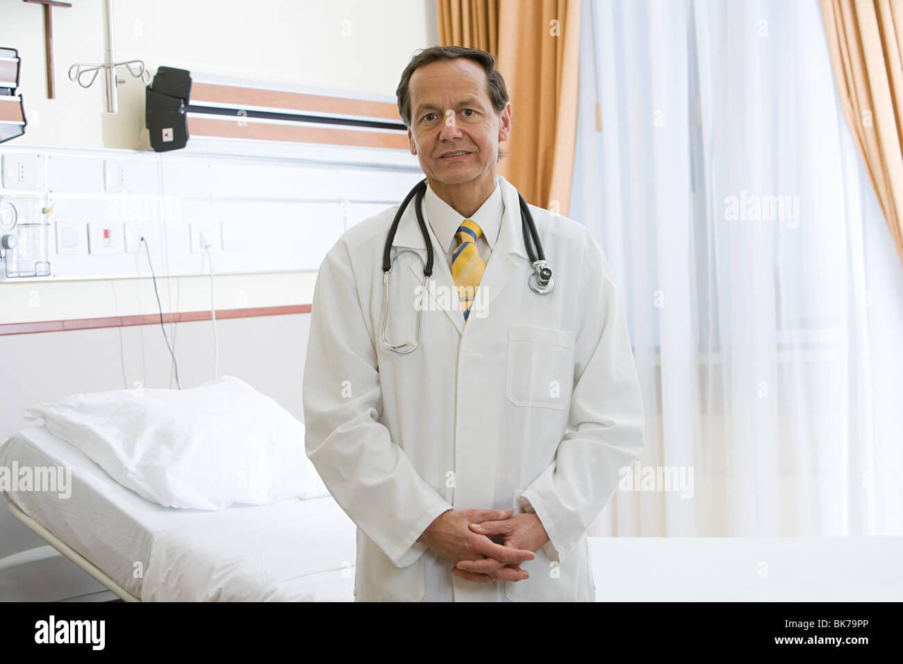 Doctor in hospital room Stock Photo