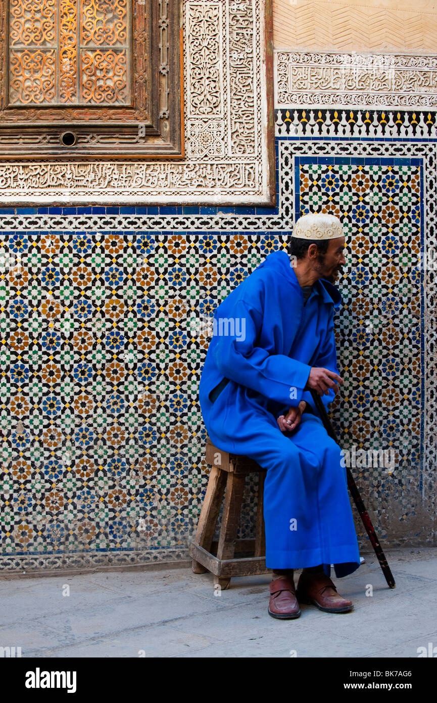 Moroccan man in front of Zaouia Moulay Idriss islamic shrine, Fes el Bali, Fez, Morocco. Stock Photo