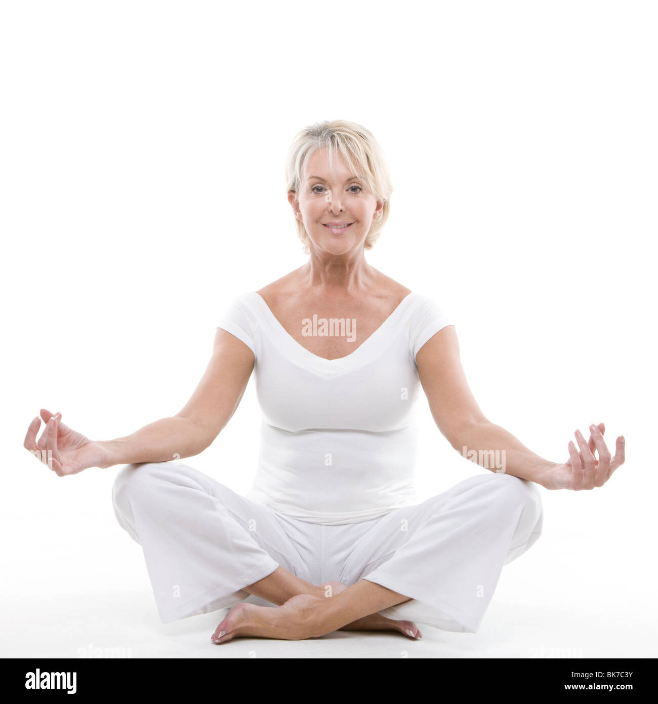 Senior woman doing yoga Stock Photo - Alamy