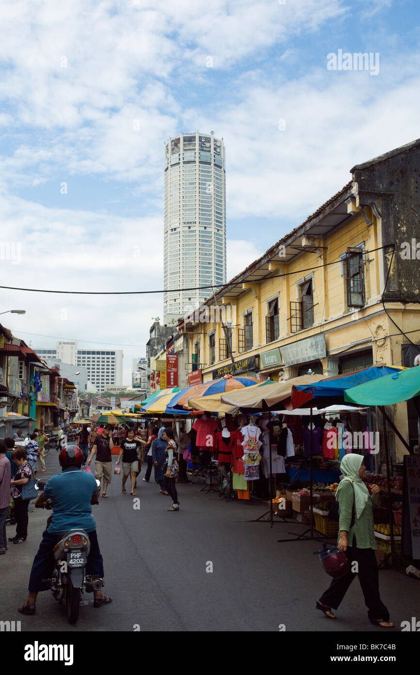 View of the Komtar 60 storey tower and a small street in Penang Chinatown. Stock Photo
