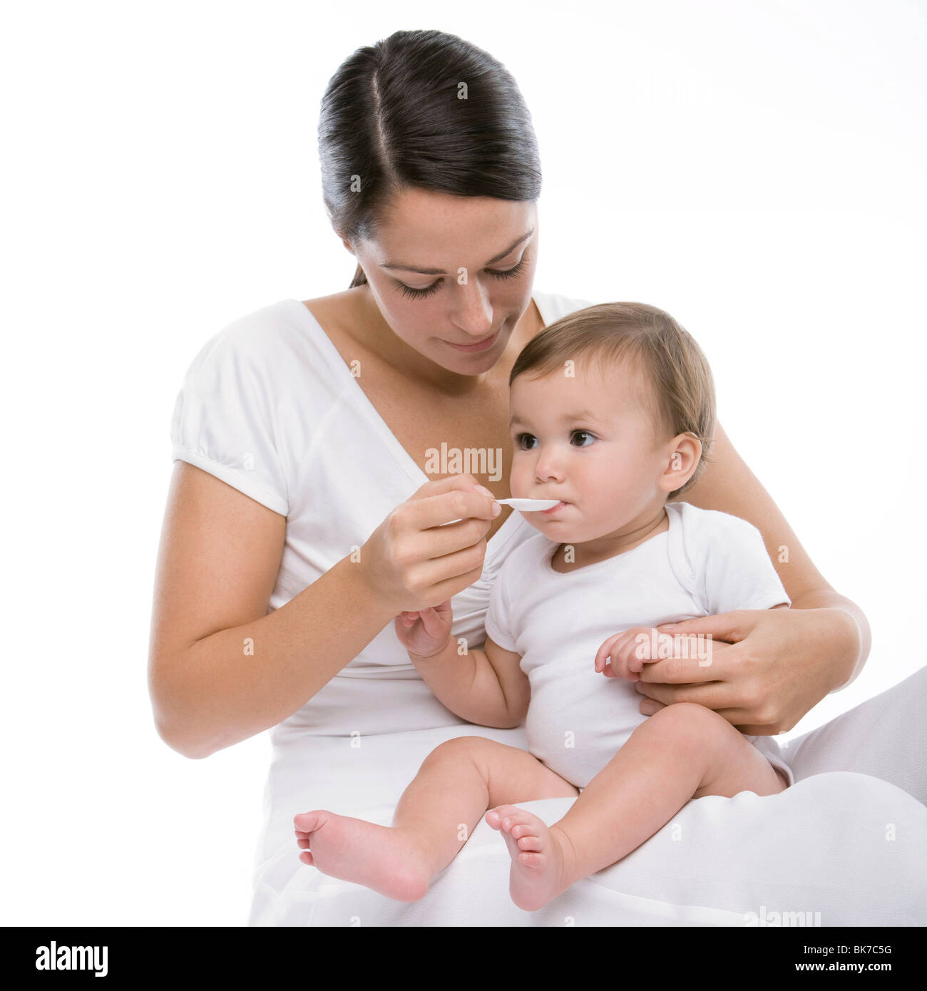 Baby taking medicine Stock Photo Alamy
