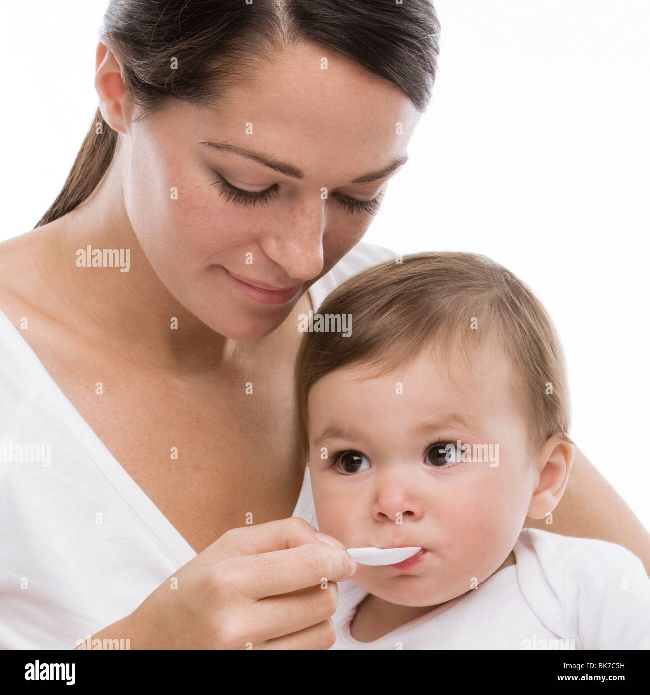Baby taking medicine Stock Photo Alamy