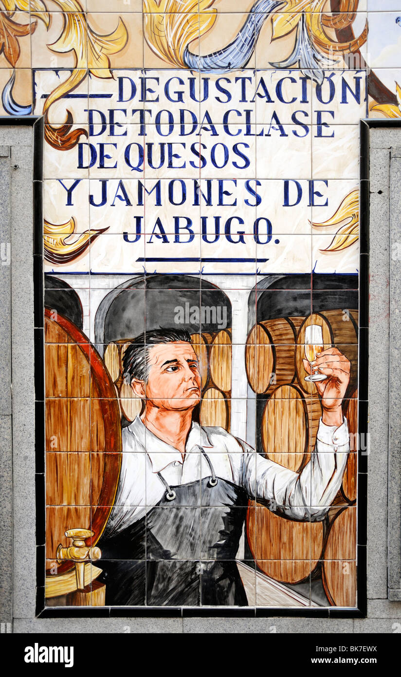 Madrid, Spain. La Chata Restaurant in Cava Baja. Famous Tiled Facade. Detail of man tasing wine Stock Photo