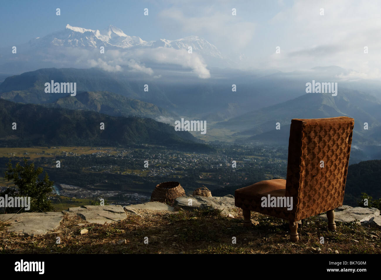 Armchair overlooking the Himalayas at sunrise near Pokhara, Nepal on Tuesday October 27, 2009. Stock Photo