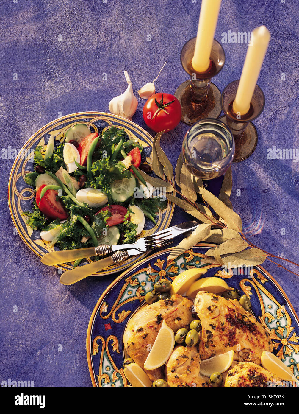 Greek chicken, olives, lemons, salad with peas, eggs, tomatoes and