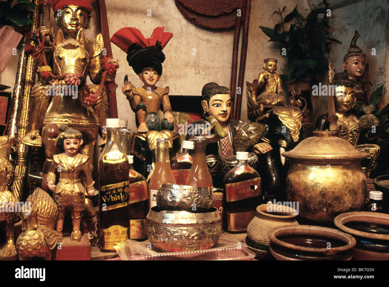 A home shrine dedicated to the Nats, a pantheon of local spirits and deified historical characters, Myanmar Stock Photo