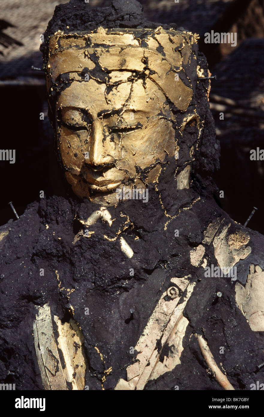 The face of Buddha emerging from the ashes, bronze casting, Mandalay, Myanmar (Burma), Asia Stock Photo