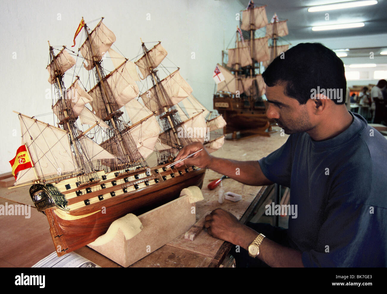 Factory worker making reproduction of old sailing ships in Mauritius, Africa Stock Photo
