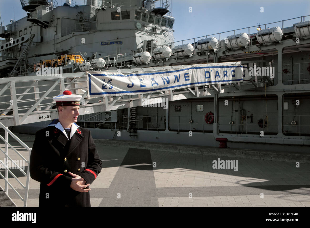 A sailor guards the French Navy Jeanne d'Arc (R97) helicopter cruiser as she is stationed in Quebec City Stock Photo