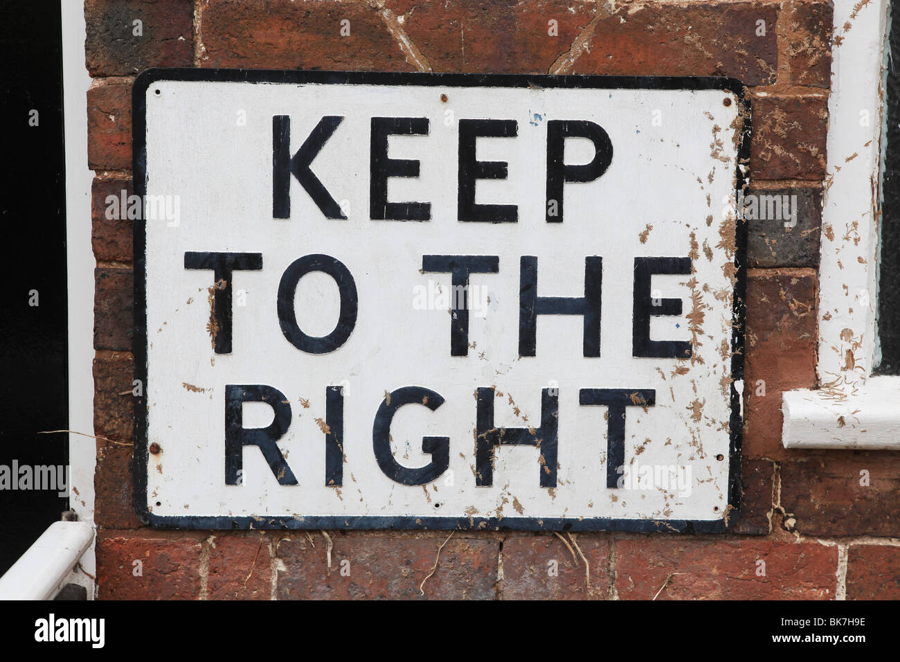 a keep to the right sign outside a public toilet in the UK Stock Photo