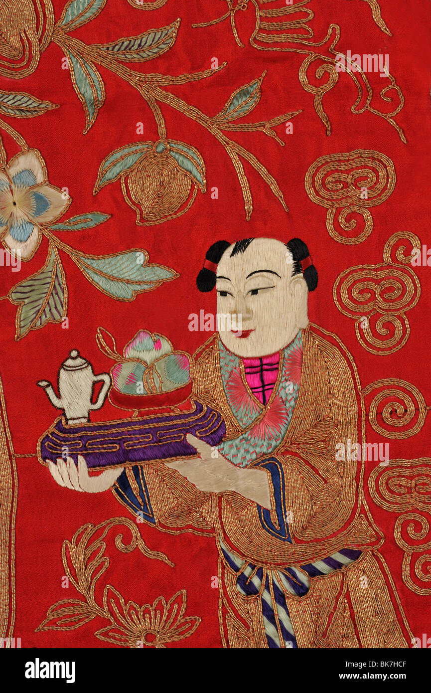Chinese embroidery of boy bringing tea, China, Asia Stock Photo