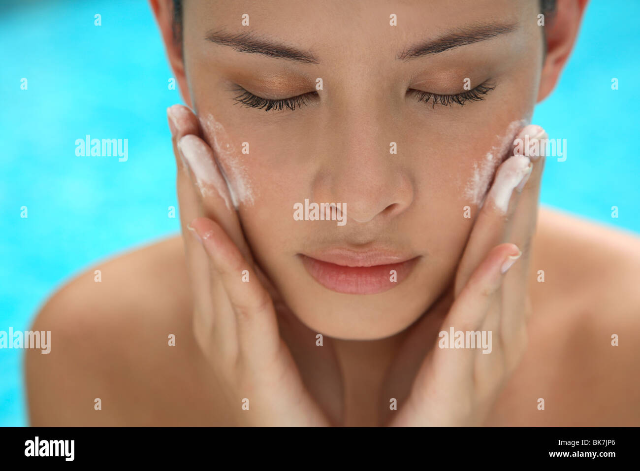 Applying pearl dust for skin Stock Photo