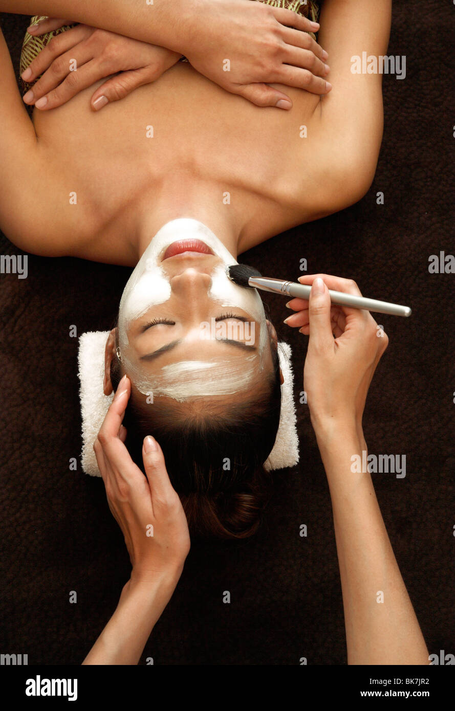 Application of facial mask for facial treatment Stock Photo