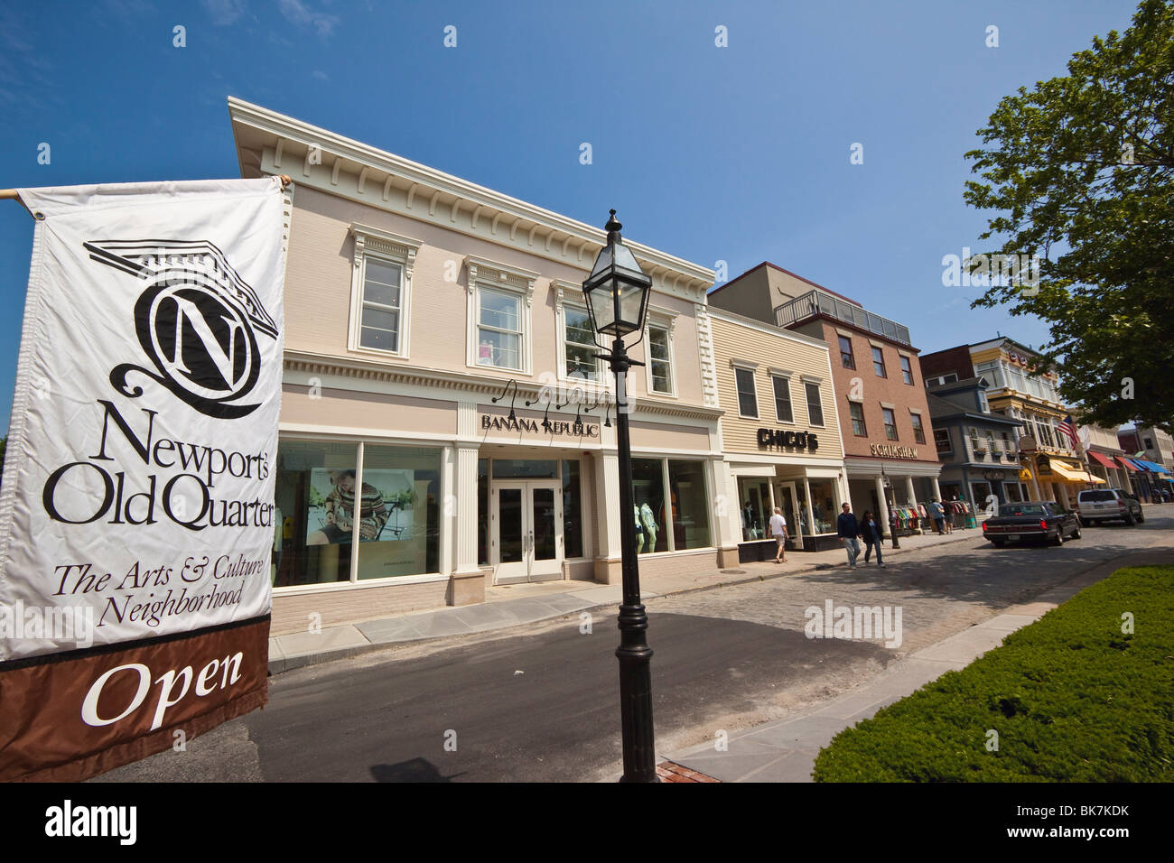 Newport Old Quarter sign and the smart shops and cobbled roadway of