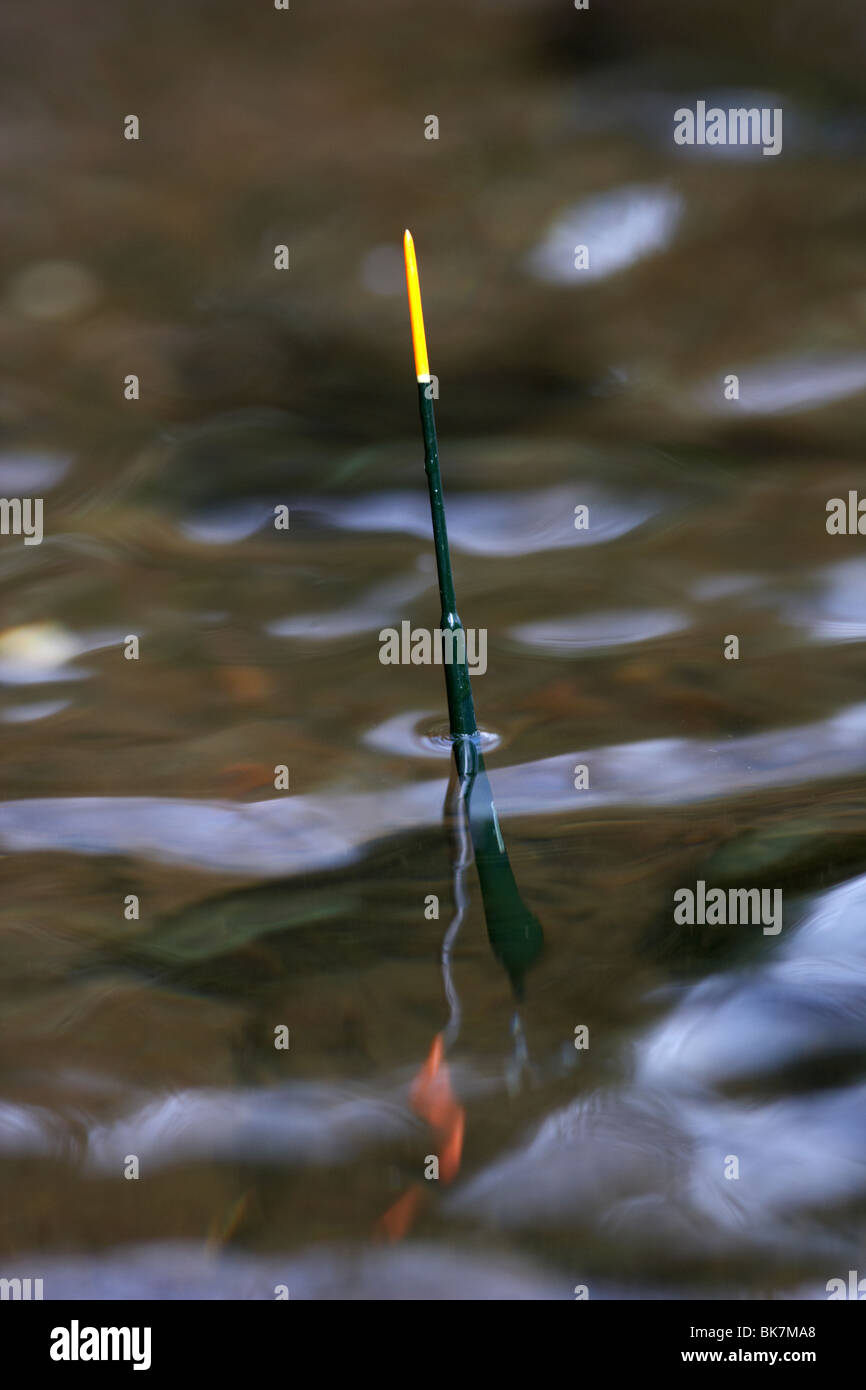 top of a fishing float showing in a river in the uk Stock Photo - Alamy