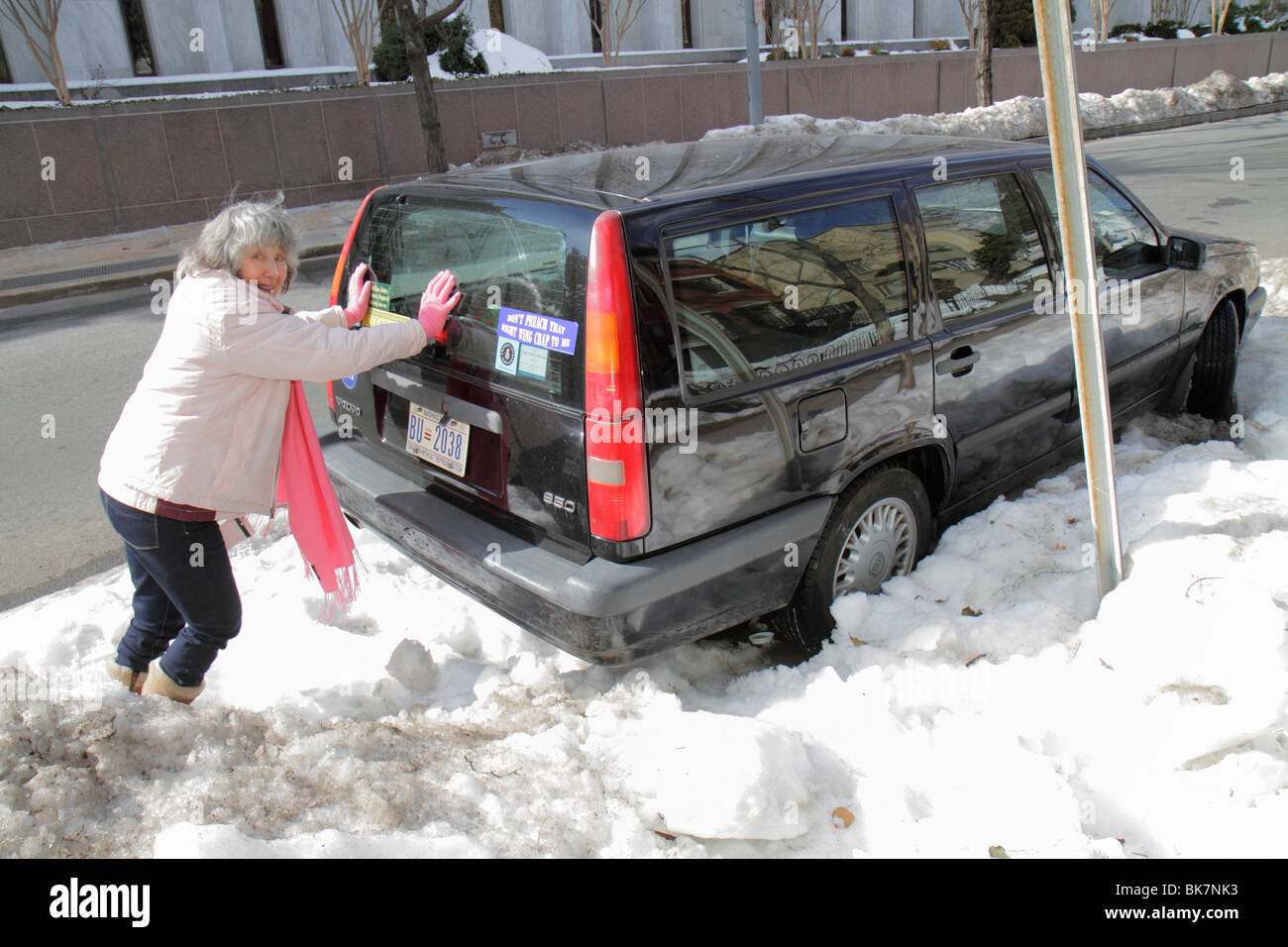 Washington DC,Capitol Hill,woman female women,SUV,snow,weather,winter,cold,stuck,push,pushing,car,DC100218065 Stock Photo