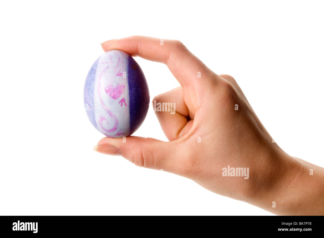 hand holding easter colored egg Stock Photo
