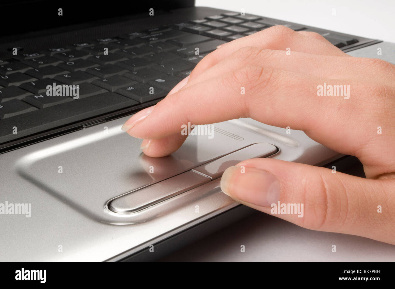 hand on computer keyboard Stock Photo