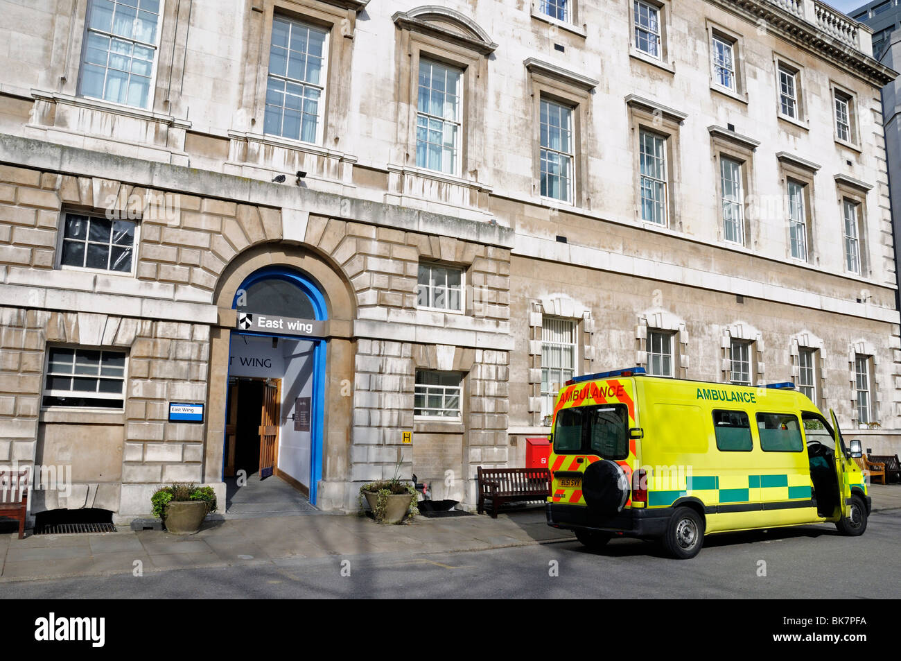 Ambulance outside St Bartholomew's Hospital East Wing City of London England UK Stock Photo