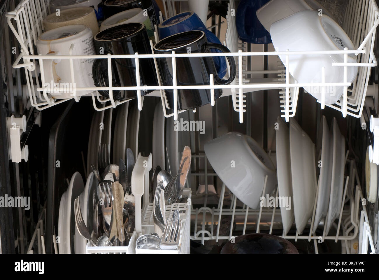 Dishes, mugs and cutlery in a dishwasher Stock Photo Alamy