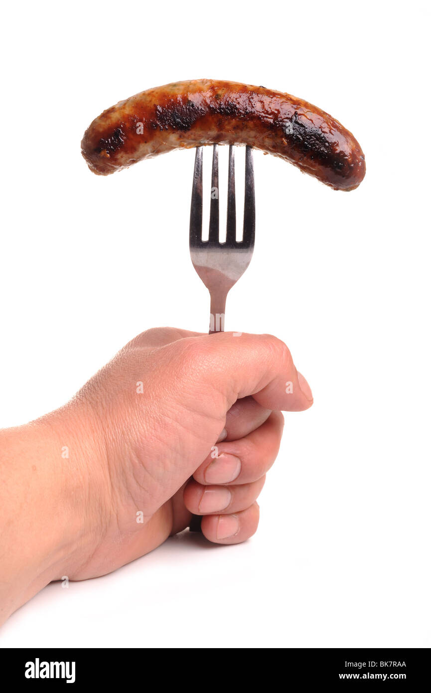 Sausage fork and hand Stock Photo Alamy