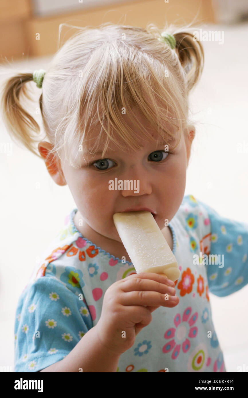 Toddler girl eating ice cream Stock Photo Alamy