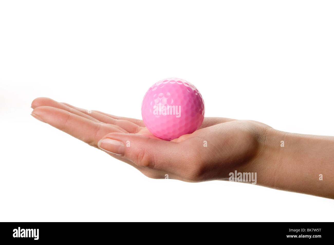 hand holding pink golf ball Stock Photo