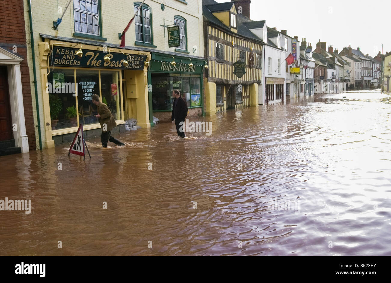 Road closed and flooding of shop premises after heavy rain at Brookend