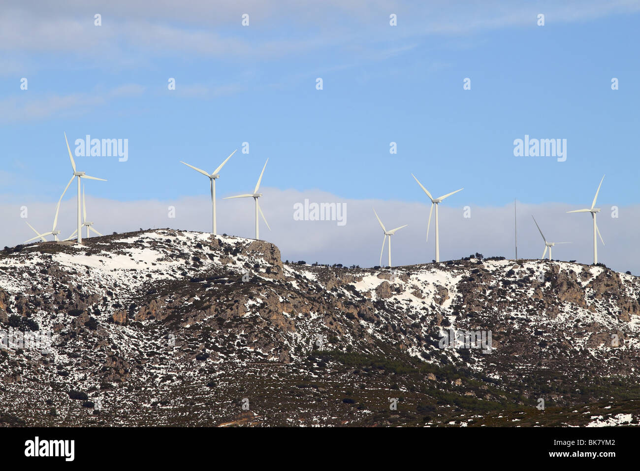 aerogenerator electric windmills on snow mountain Stock Photo