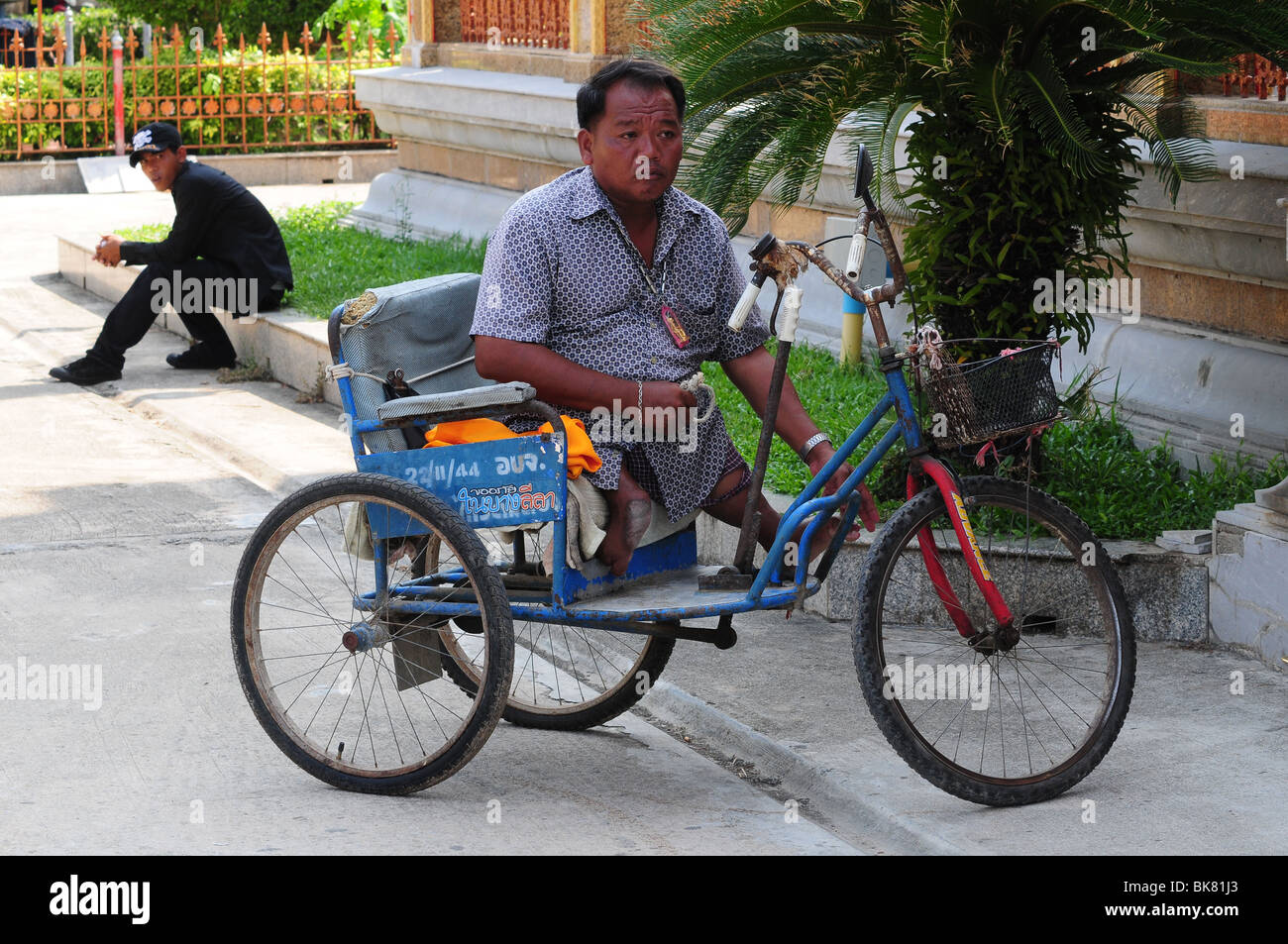 Disabled beggar in Thailand Stock Photo