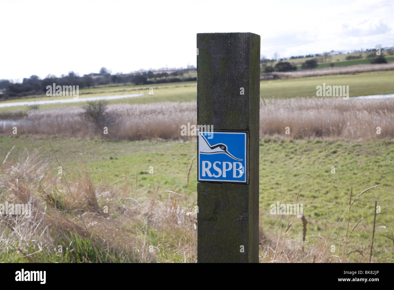RSPB sign on wooden post Boyton marshes, Suffolk Stock Photo