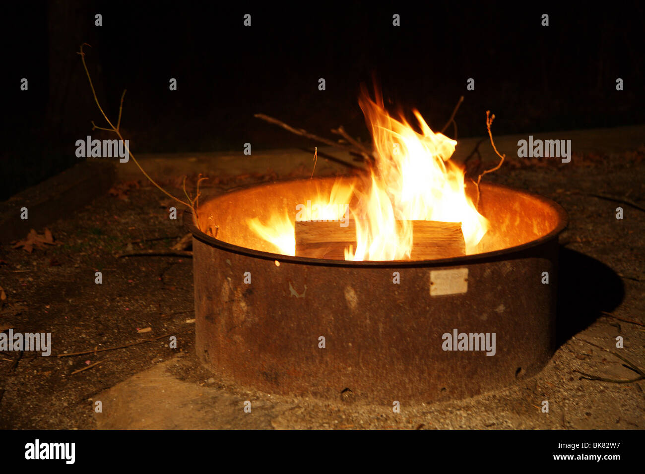 FIRE BURNING IN CAMPSITE FIRE RING FIRE SAFETY Stock Photo Alamy
