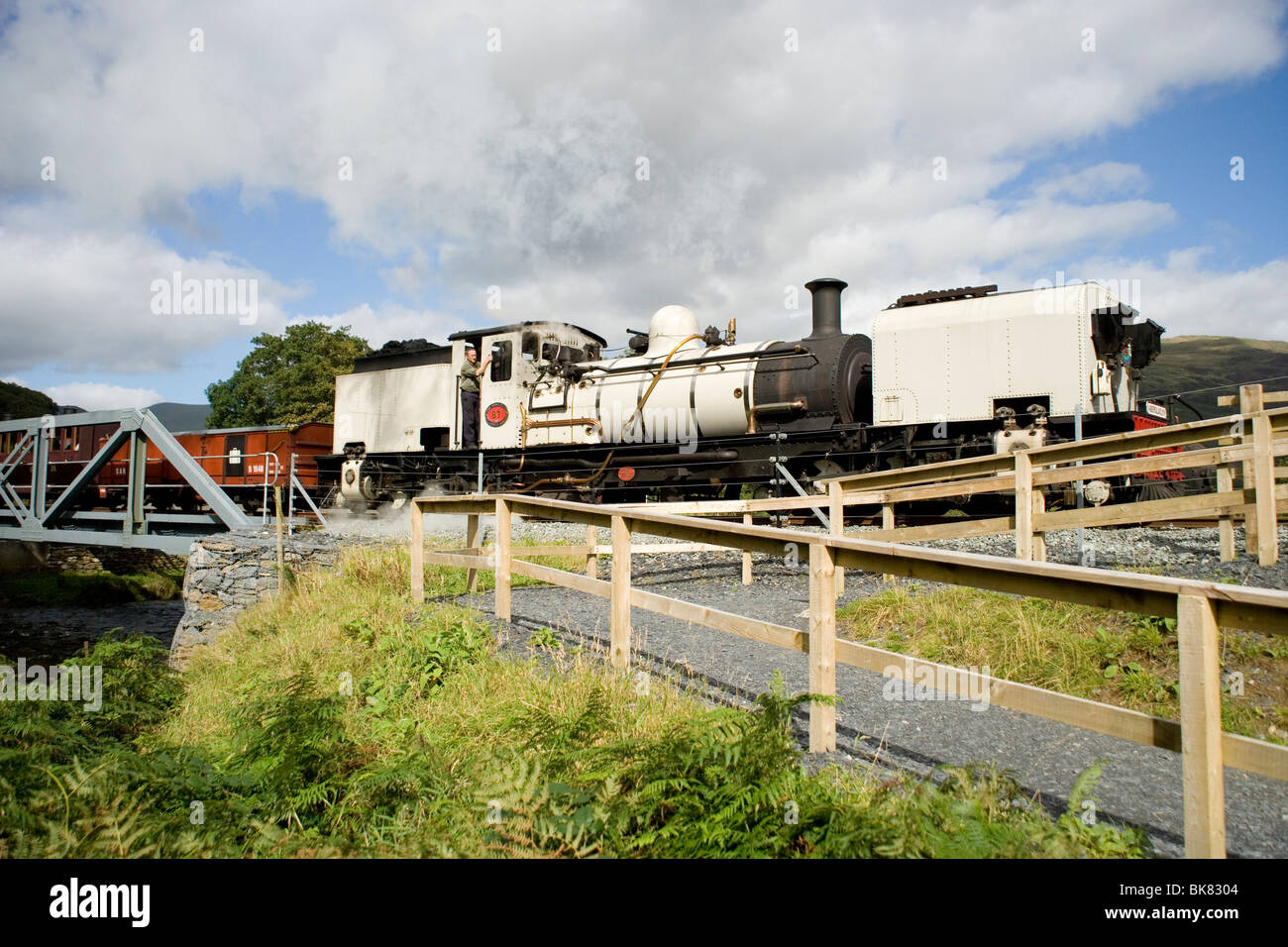 Welsh Highland steam train crossing rhe Railway bridge in the Aberglaslyn pass near Beddgelert and the Glaslyn river,Snowdonia Stock Photo