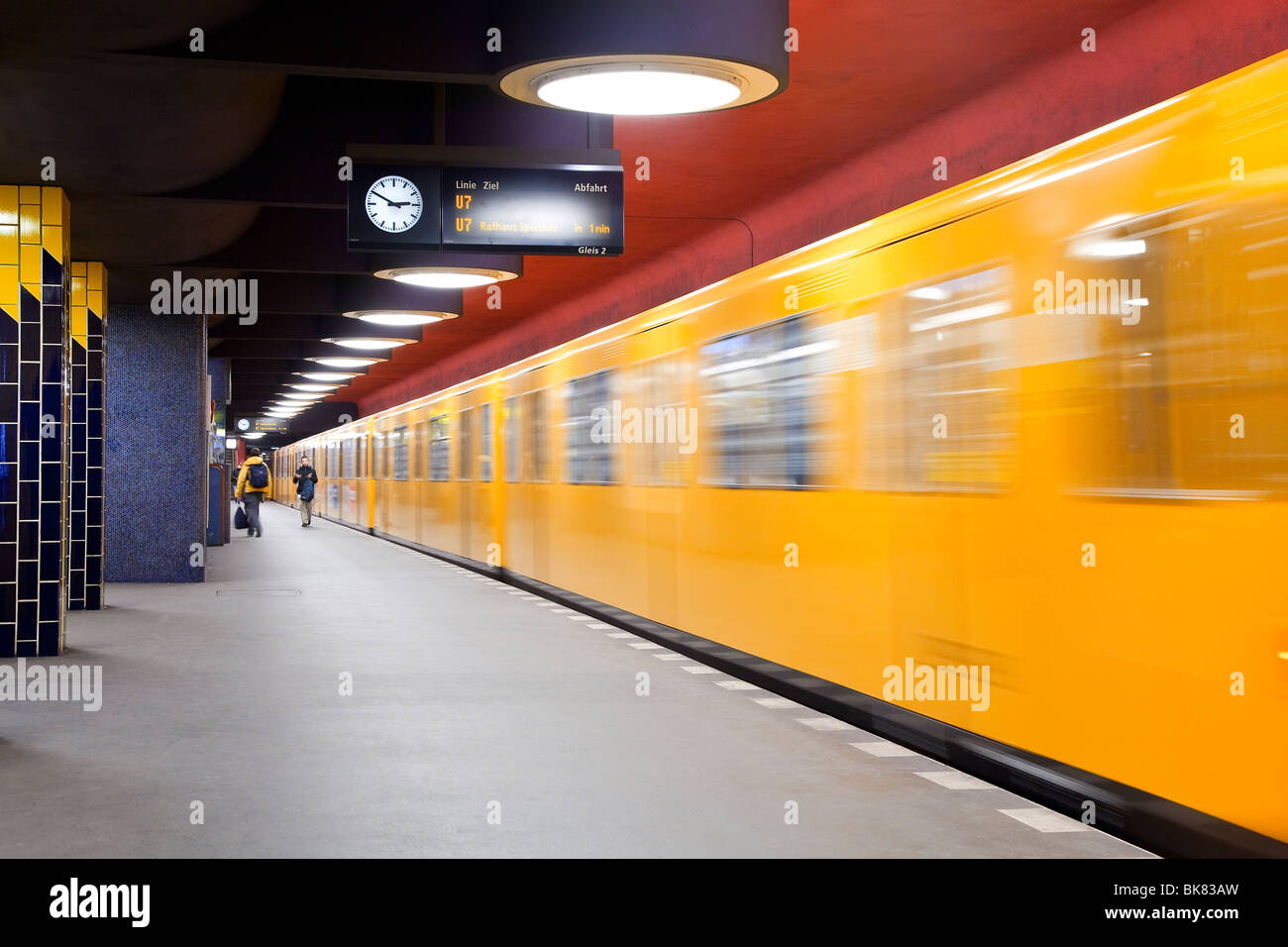 Europe, Germany, Berlin, modern subway station - moving train pulling into the station Stock Photo