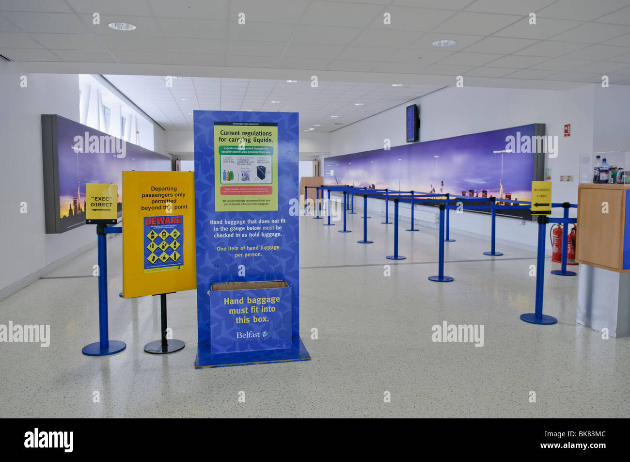 Signs at approach to airport security, warning passengers about prohibited items. Stock Photo